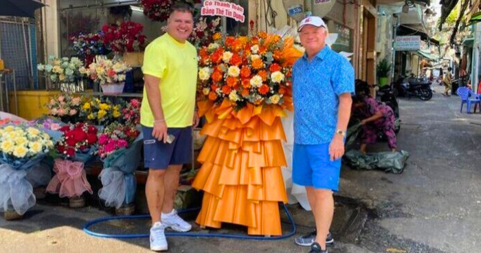 two men at a flower market