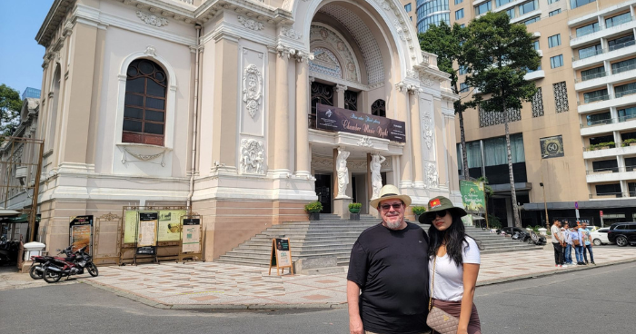 two tourists at an opera house