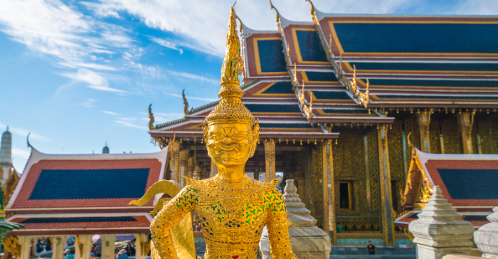 a golden Buddha statue at a temple 