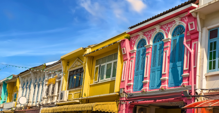 a row of colourful colonial-style houses 