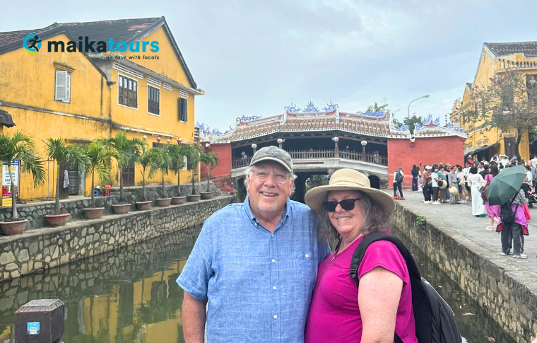 a couple standing in hoi an ancient town