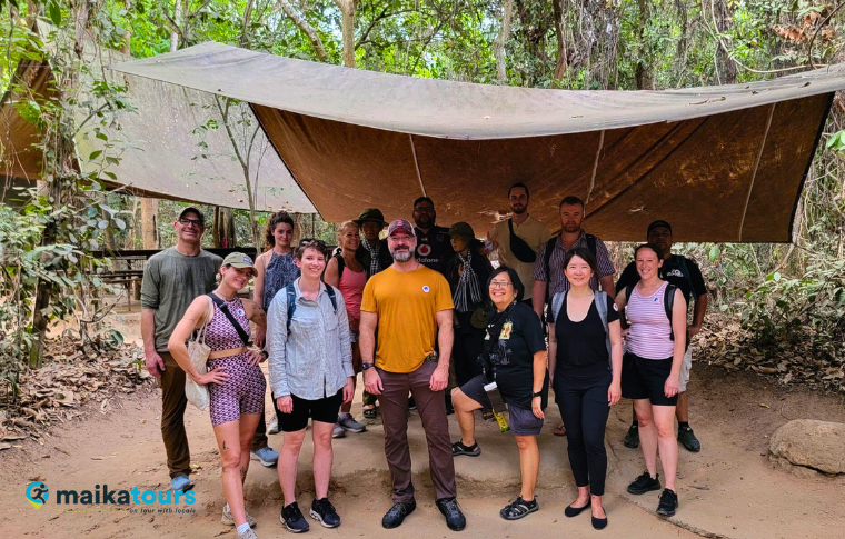 a group of tourists under the army tent 